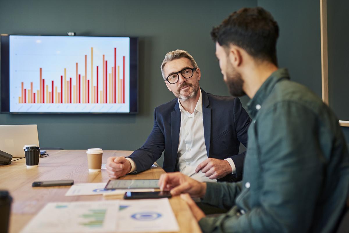 two business men going over numbers for increasing valuation 
