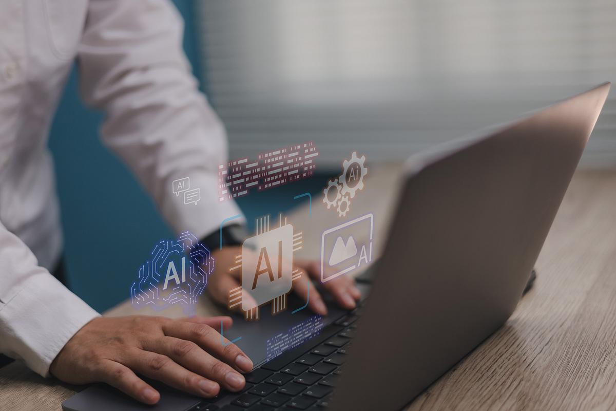 a man typing on a laptop with overlay of graphics indicating ai capabilities 